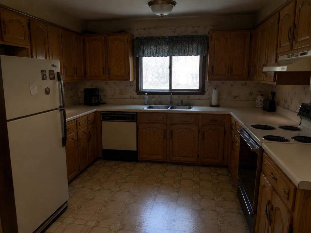 Dated oak kitchen to bright white remodel in Las Vegas, NV — before kitchen remodeling